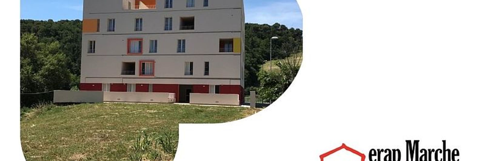 Fabbricato e scritta Erap Marche Ente Regionale per l'Abitazione Pubblica