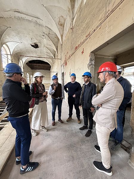 Il sindaco Biancani, l'assessore Pozzi e i professionisti del Comune durante il sopralluogo nei cantieri dei contenitori culturali della città